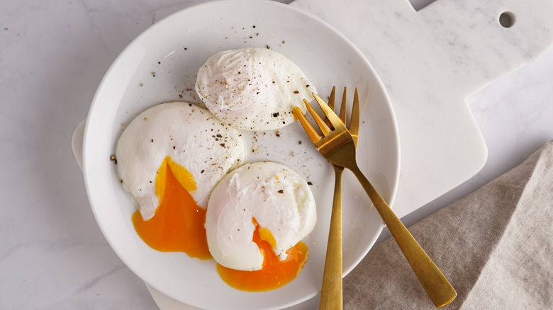 Plate of three poached eggs