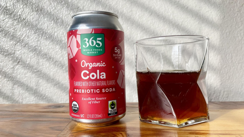 A glass and can of 365 By Whole Foods Market Organic Cola﻿ on a table.