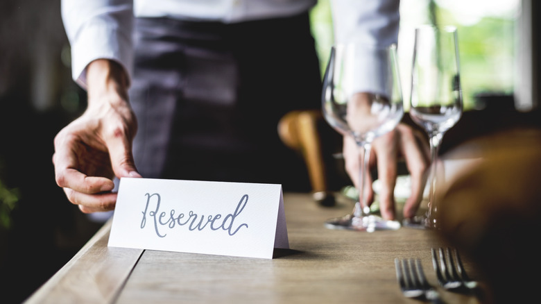 Dining table with reserved sign