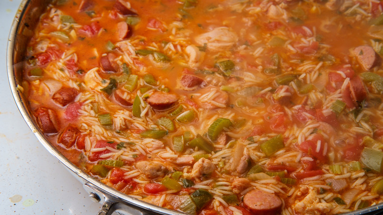 Large pan of Creole jambalaya, made with tomatoes