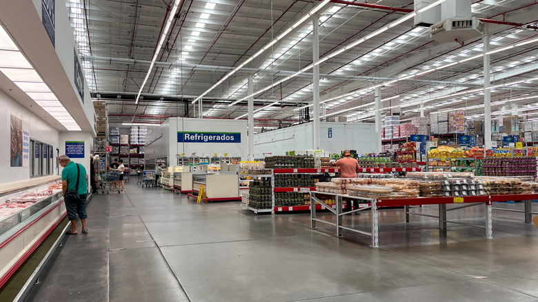 Customers shop in the bakery and refrigerated section of Sam's Club