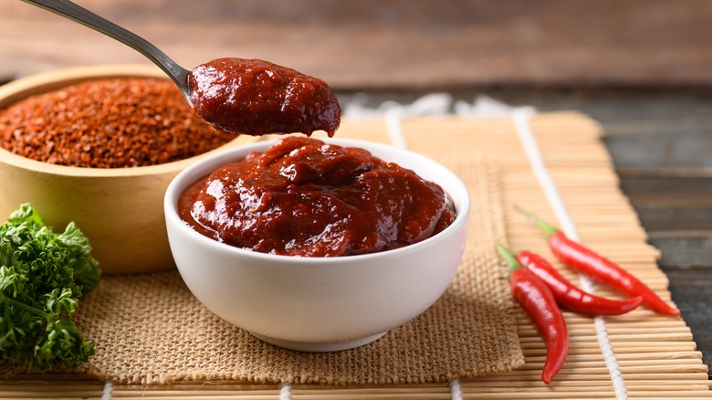 bowl and spoon of gochujang paste