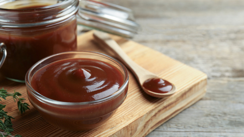 Barbecue sauce in a bowl and a jar.