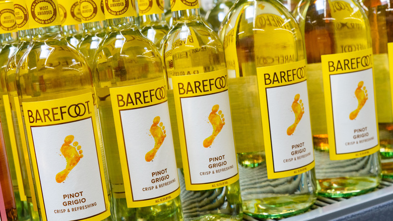 Bottles of Barefoot wine in a grocery store.