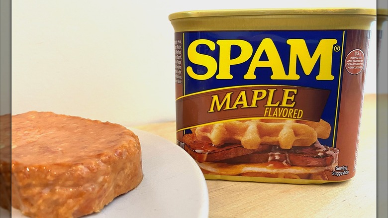 A slice of Spam Maple Flavored on a plate next to the can