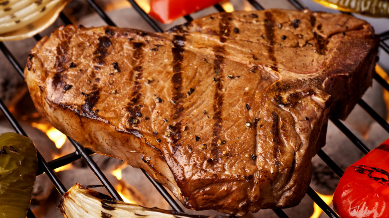 T bone steak on a grill
