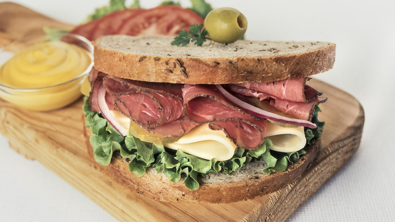 Pastrami meat cheese sandwich on rye bread