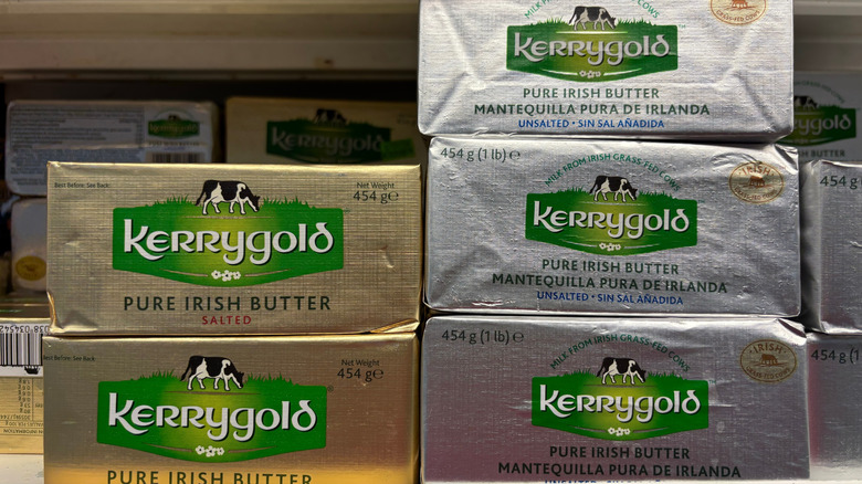 Blocks of Kerrygold butter, both in salted and unsalted, stacked in a grocery store