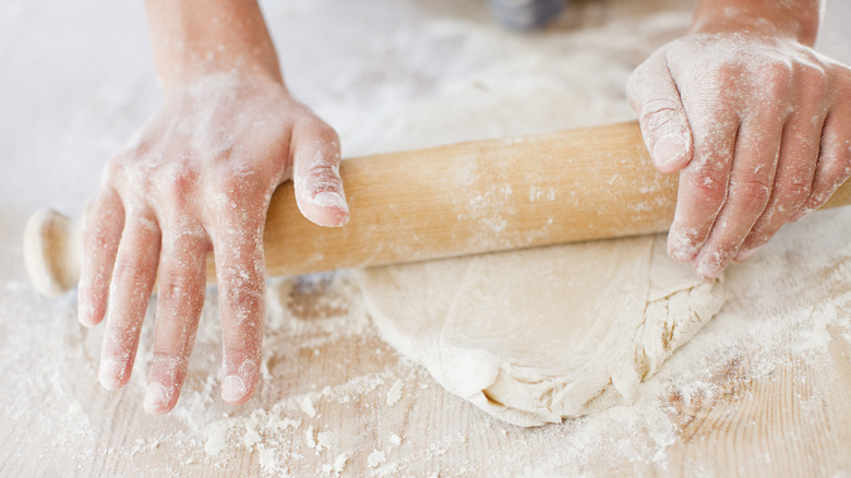 Woman rolling out dough