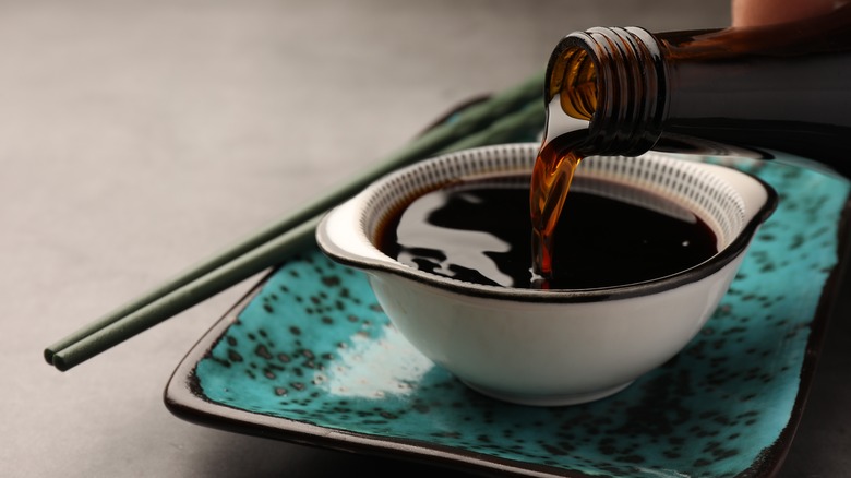 Soy sauce being poured into a bowl