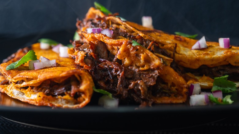 A plate of birria tacos