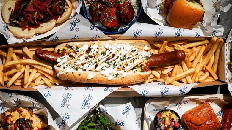 Array of food available at Dodger Stadium including a Dodger Dog with fries