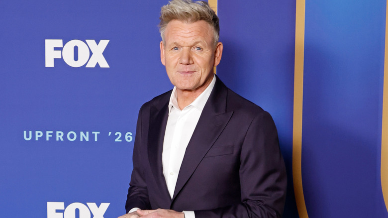 Gordon Ramsay posing at an event.