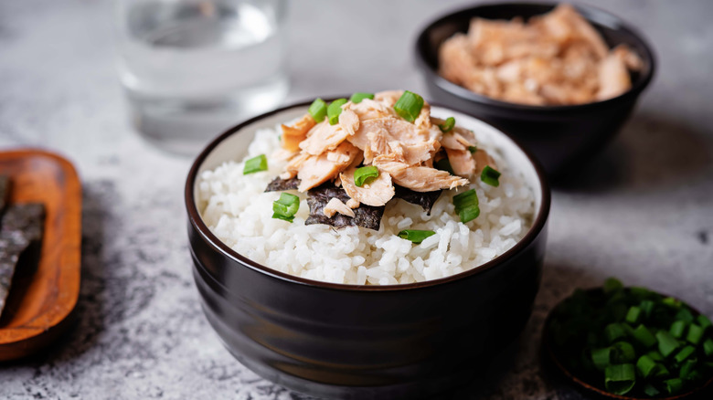 Flaked salmon on rice bowl.