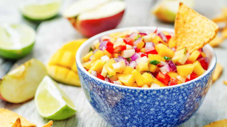 mango salsa surrounded by fruit