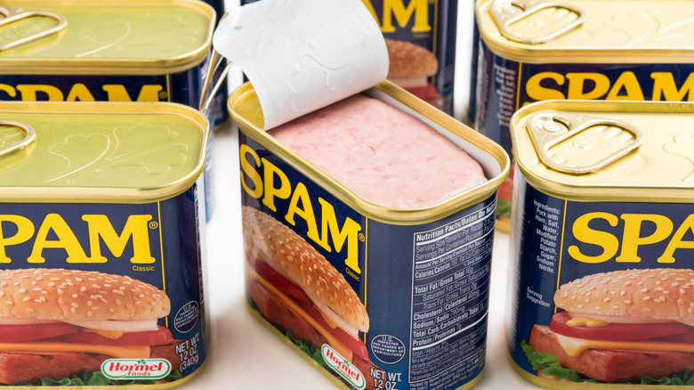Cans of Spam tinned meat product with one opened lid