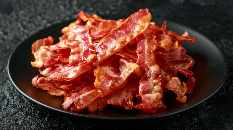 plate of cooked crisped bacon
