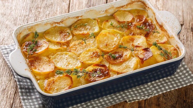 Scalloped potatoes in a ceramic baking dish