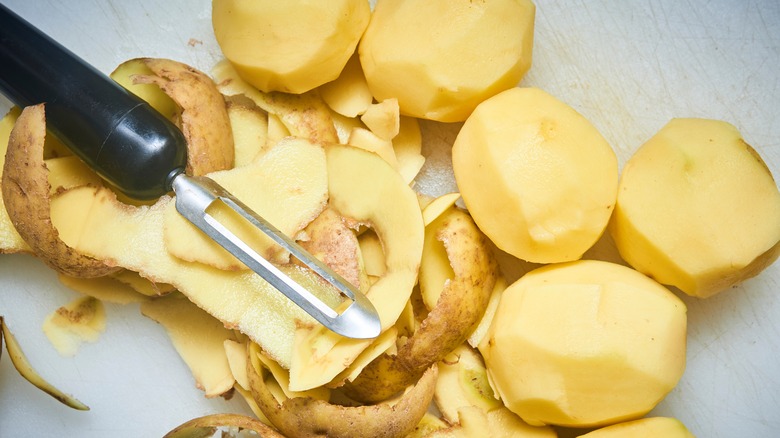 Starchy Russet potatoes peeled ready for cooking