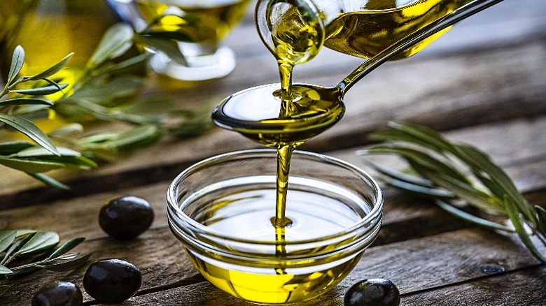 Olive oil poured in bowl