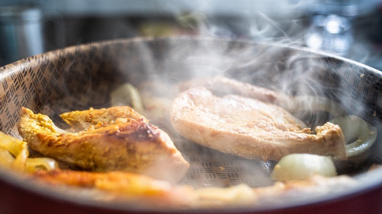 Food cooking on pan