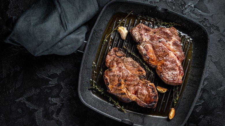 Pork steaks in a cast iron pan
