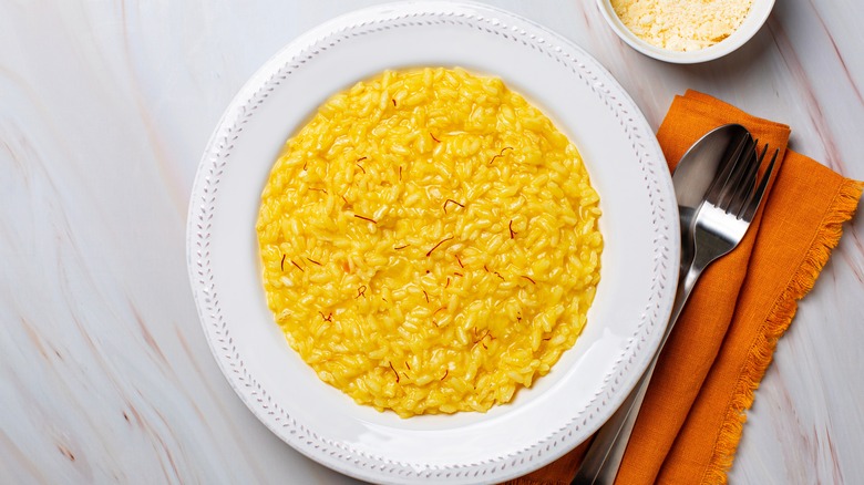 Saffron risotto on white round plate