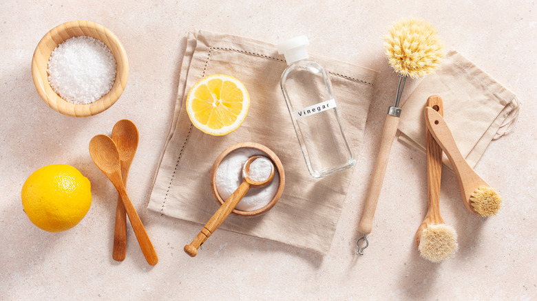 Baking soda with jars and cleaning tools