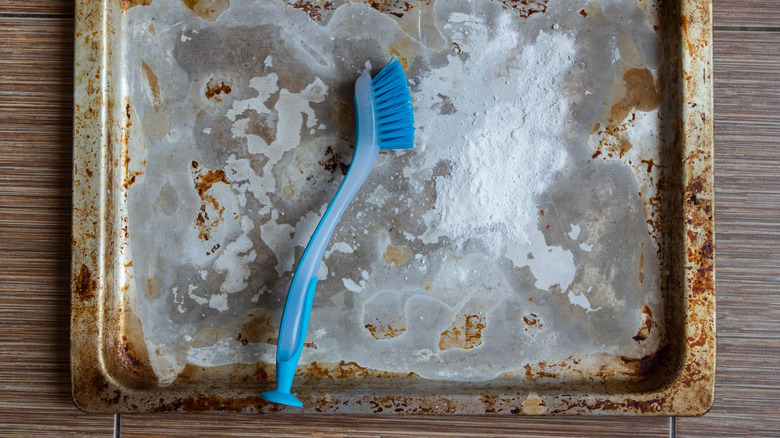 Dirty baking sheet with brush