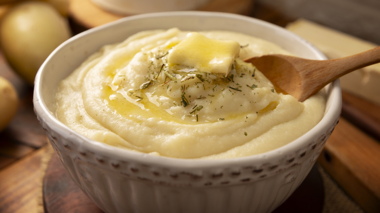 Bowl of buttery mashed potatoes.