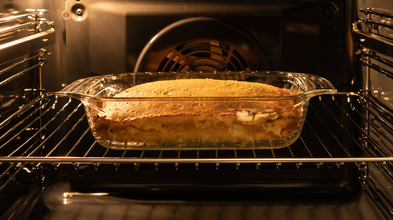 Food baking in a glass tray in an oven