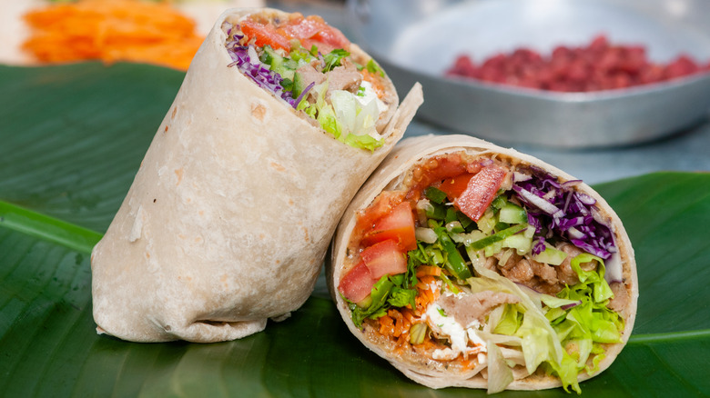 Burrito with tomatoes sour cream