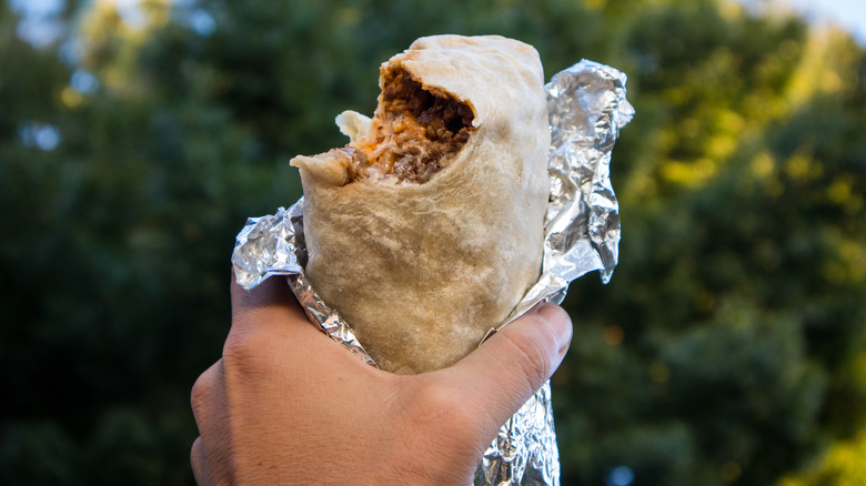 Bitten burrito wrapped in foil