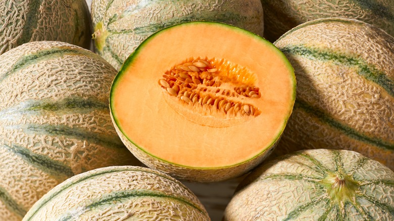 Whole and halved cantaloupe
