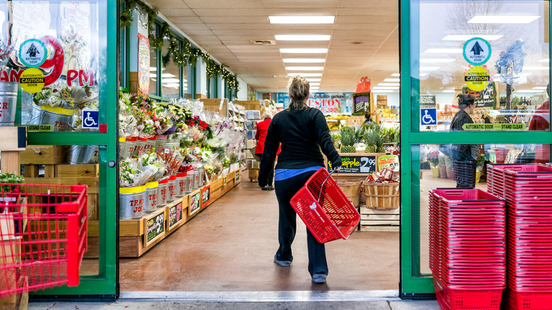 shopper walking into trader joe's