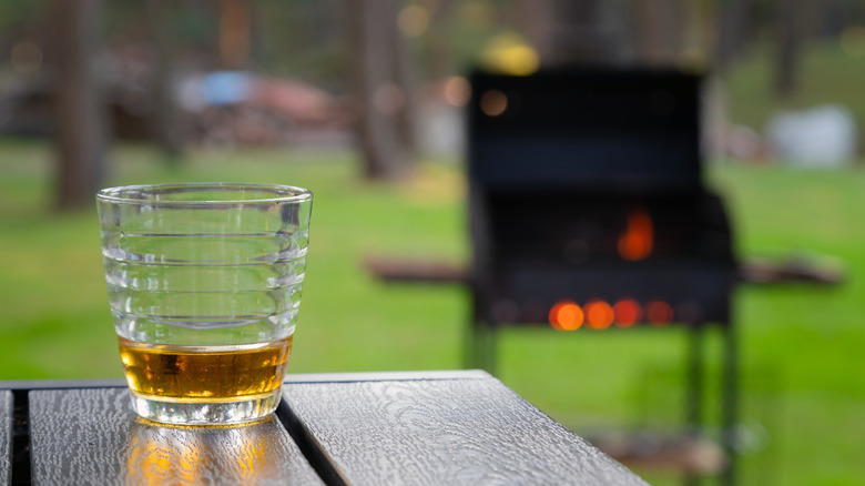 Whiskey with grill in the background