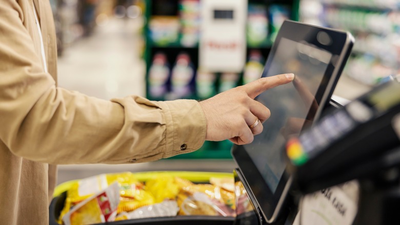 Person at self-checkout