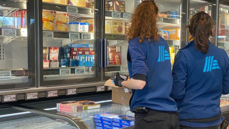 Aldi workers in the frozen section