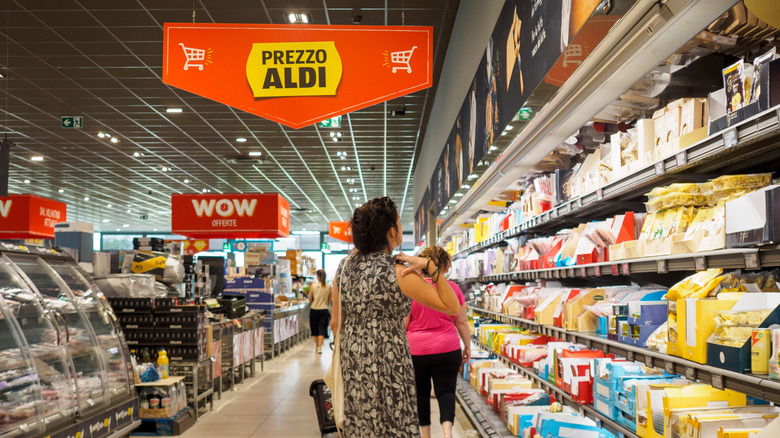 shoppers in an Aldi aisle during the day