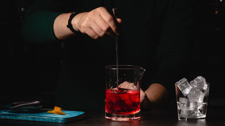 Bartender stirring a Negroni