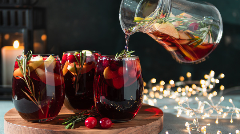 pitcher pouring into glass of cocktail