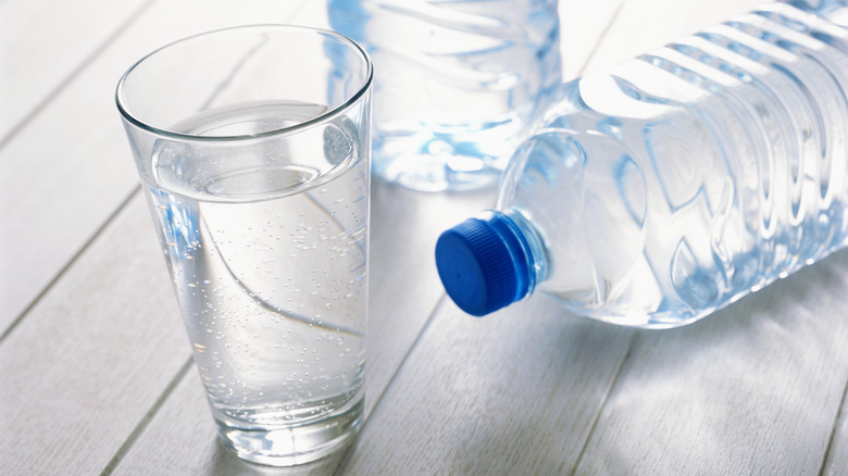 Glass and bottle of water