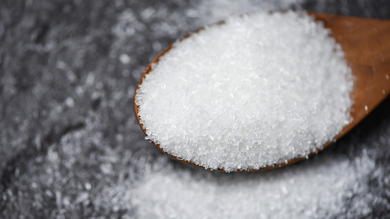 MSG crystals on a spoon