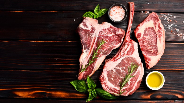 Three raw steaks