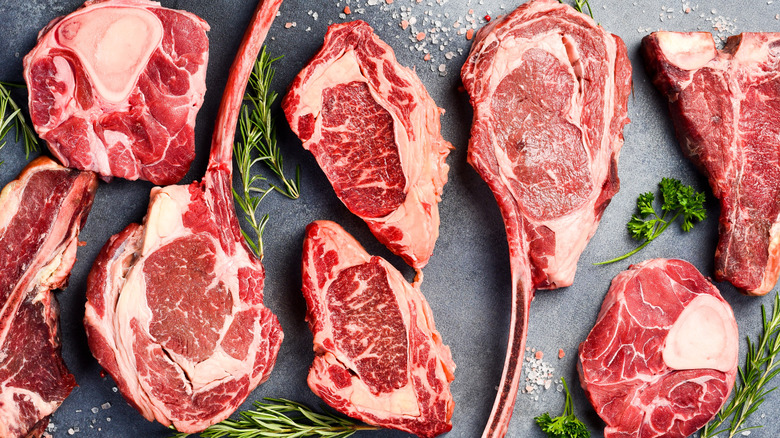 Various raw beef steaks.