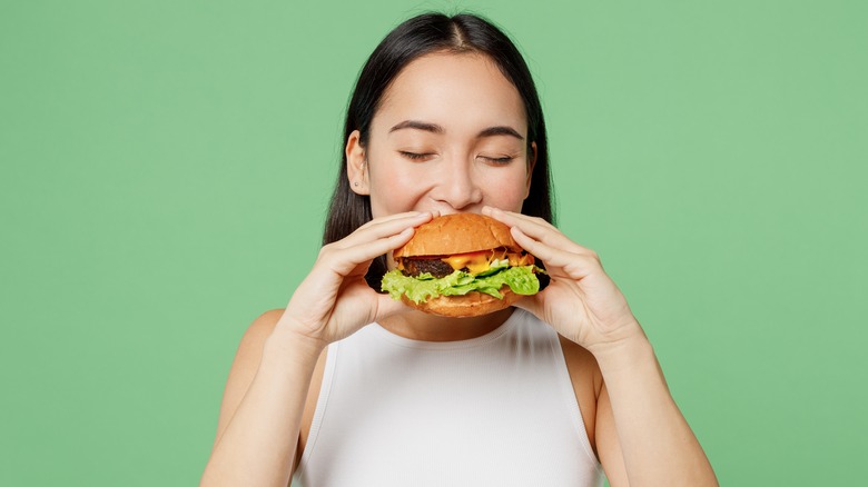 Woman eating burger