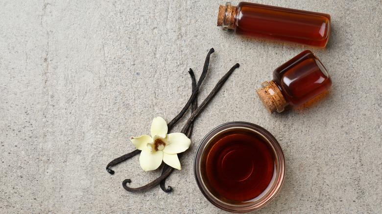 Vanilla extract, beans, and flower