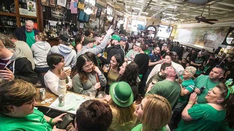 interior of Doyle's Cafe, busy and full of patrons clamoring for a drink