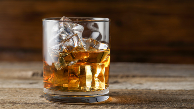 A glass of bourbon and ice.