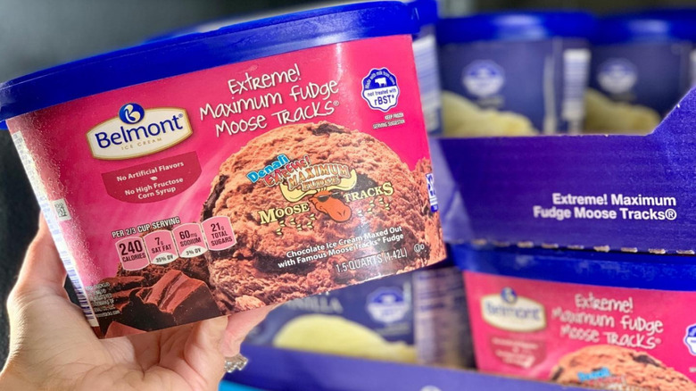 someone pulls out a carton of Belmont Extreme! Maximum Fudge Moose Tracks ice cream from an Aldi freezer
